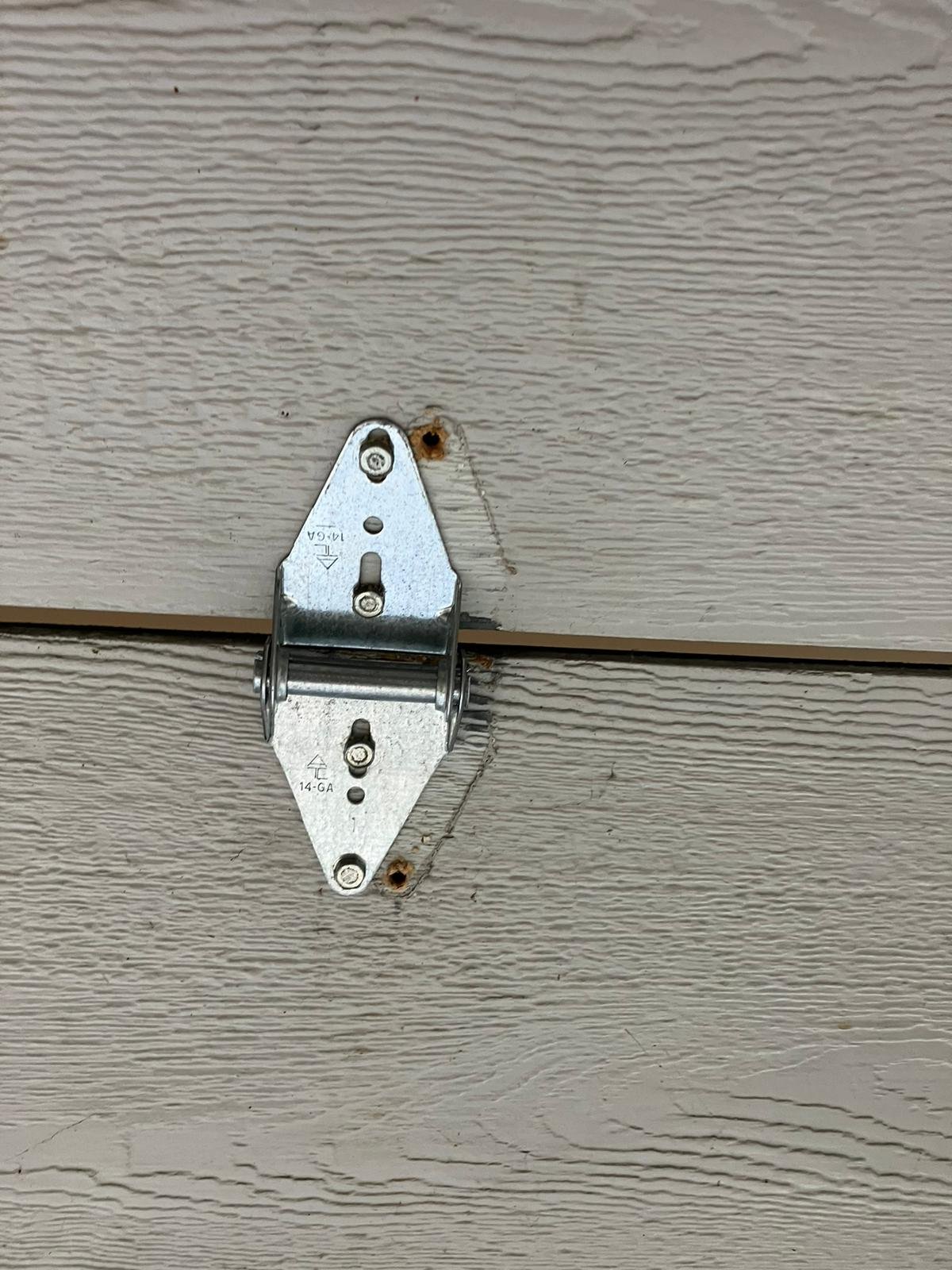 a photo of garage door hinges